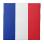 Franse vlag tegeltje<br><div class="desc">De Franse vlag is een verticale driehoek. De gebruikte kleuren in de vlag zijn blauw, rood, wit. Het aandeel van de Franse vlag is 2:3. De vlag van Frankrijk werd in 1830 aangenomen. Het eerste gebruik van het huidige vlagontwerp was in 1794. De laatste wijziging van het huidige Franse vlagontwerp...</div>