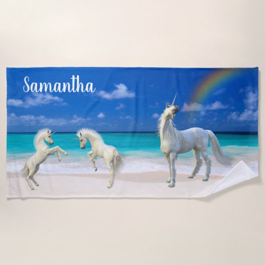 Frolicking eenhoorn veulens op het strand geperson strandlaken (Voorkant)