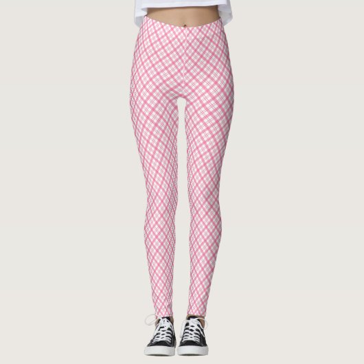 Front and back views of pink plaid leggings worn  (Voorkant)
