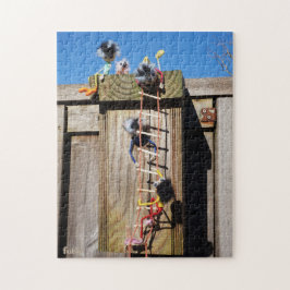 Fubby's die een vogelhuis beklimmen. legpuzzel