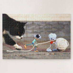 Fubby's spelen met bol touw en Poes Ping. Legpuzzel