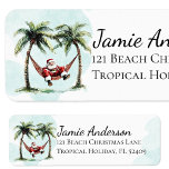 Fun Beach Santa Tropical Christmas Retouradres Etiket<br><div class="desc">Spice up uw kust vakantie mailings met deze grillige waterverf strand kerstontwerp! Sinterklaas trapt terug in zijn rode pak op een hangmat tussen twee palmbomen. Het is de perfecte manier om een vleugje tropisch gejuich te brengen voor de groeten van je seizoen.</div>