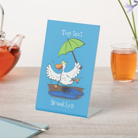 Funny eend met paraplu dansende cartoon reclamebord met voetstuk (Insitu)