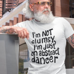 Funny Fun Not Clumsy Abstracte danser T-shirt<br><div class="desc">Op zoek naar een uniek en leuk shirt dat je persoonlijkheid perfect weergeeft? Kijk niet verder dan dit shirt met de originele hand in het zwart met de grappige, slimme uitdrukking "Ik ben niet onhandig, ik ben gewoon een abstracte danseres". Deze gedrukte tekst voegt zeker een beetje humor en griezeligheid...</div>