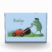 Funny green frog mowing grawn cartoon fotoblokken (Voorkant)
