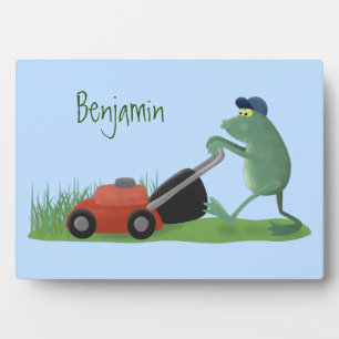 Funny green frog mowing grawn cartoon fotoplaat