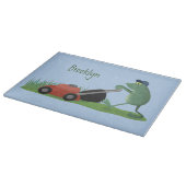 Funny green frog mowing grawn cartoon snijplank (Hoek)
