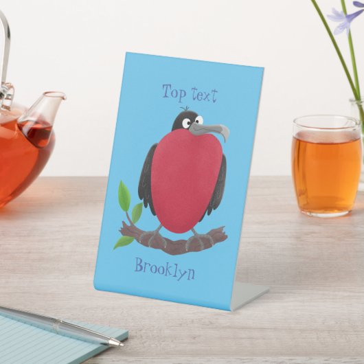 Funny magnificous frigate bird cartoon reclamebord met voetstuk (Insitu)