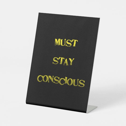 Funny "Must Stay Conscious" Reminder Reclamebord Met Voetstuk (Voorkant)