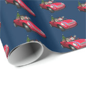 Funny Santa Claus rijdt een mini Cadeaupapier (Rol Hoek)