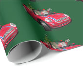 Funny Santa Claus rijdt een mini Cadeaupapier (Rol Hoek)