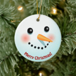 Funny Snowman wordt geconfronteerd met een Cartoon Keramisch Ornament<br><div class="desc">Dit grappige ornament met een sneeuwpop met een wortelneus en roze wangen kan aan beide zijden volledig worden aangepast met je eigen boodschappen. Vervang de tekst (hier getoond met "Vrolijk Kerstfeest!" en "Prettige feestdagen!") en creëer een van een soort ornament,  perfect voor elke kerstboom!</div>