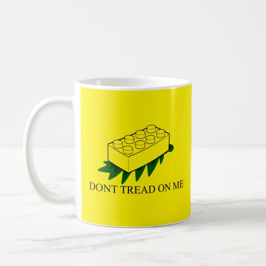 Fuzzy Express® Gadsden Flag Brick Joke Geel Koffiemok (Links)