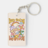 Ga door, blijf groeien | Paddenstoel & Bloemen Sleutelhanger (achterkant)