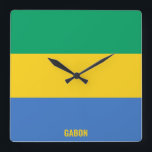 Gabon National Flag Patriotic Vierkante Klok<br><div class="desc">Gabon National Flag Patriotic Square Wall Clock met de landvlag in de nationale kleuren die de hele tijd worden gedrukt. De naam van het land is subtiel geïntegreerd in het ontwerp onderaan. De tekst kan volledig worden aangepast met de functie "Aanpassen!". Dit charmerende ontwerp is het verbluffende geschenk en het...</div>