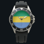 Gabonese vlag (Gabon) Horloge<br><div class="desc">Dit ontwerp is voorzien van de nationale vlag van Gabon, een land aan de westkust van Centraal-Afrika. Gabon bevindt zich op de evenaar. Gabon wordt door Equatoriaal-Guinea begrensd tot het noordwesten, Kameroen tot het noorden, de Republiek Congo in het oosten en zuiden en de Golf van Guinee tot het westen....</div>