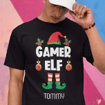 Gamer elf leuke ironische kerstfamilienaam t-shirt<br><div class="desc">Deze grappige zelfbevregende gamer elf-T-shirt, die deel uitmaakt van een overeenkomend collectie voor zelfkleding met geschenken voor elk familielid, zal je helpen om in de vakantiemoed te geraken. Deze t-shirt is perfect voor elke kerstfamiliegeling en is voorzien van een schattig pet en leuke poten, met de titel "Gamer elf" in...</div>