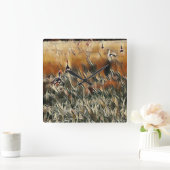 Ganzen en eenden lopen rond kunst vierkante klok (Huis)