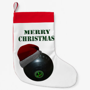 Gazonkom met een kerstmuts, kleine kerstsok