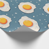 Gebakken eieren op blauw cadeaupapier (Hoek)