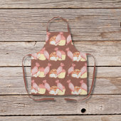 Gebakszakken, kaneelbroodjes en bruine cupcakes schort