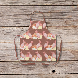 Gebakszakken, kaneelbroodjes en bruine cupcakes schort