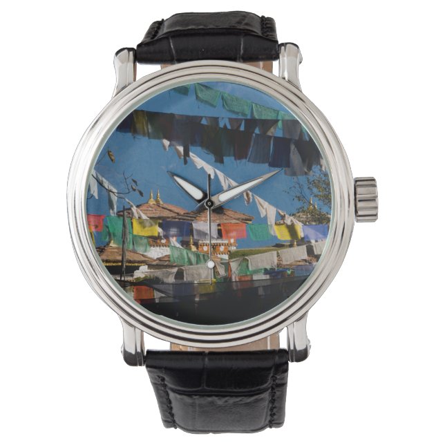 Gebedsvaantjes en chortens horloge (Voorkant)