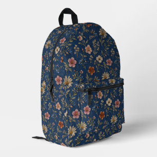 Geborduurde gewone wilde bloemen op denim achtergr bedrukte rugzak