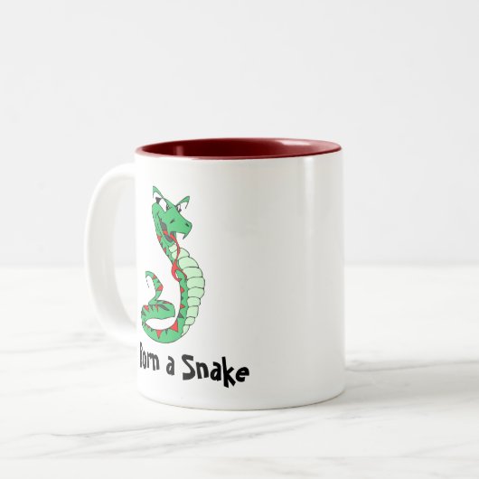 Geboren in een slang tweekleurige koffiemok (Voorkant links)