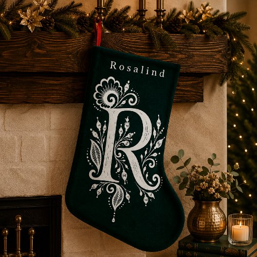 Gebreide muts met botanisch monogram met de letter kleine kerstsok