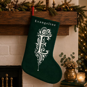 Gebreide sok met botanisch monogram van de letter kleine kerstsok