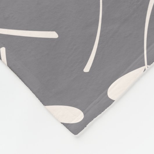 Gecasseerde lederen patrooncrème op grijs fleece deken (Hoek)