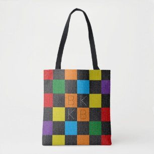 Gecontroleerde monogram patroonmeisje met regenboo tote bag