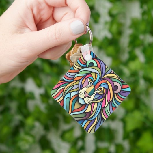 Gedetailleerde kleurrijke leeuwenkop sleutelhanger (Hand)