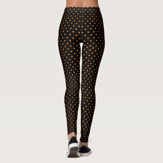 GEDRUKTE LEGGINGS ZWARTE MET ORANJE POLKA DOTS (Achterkant)