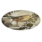 Geel en groen vogel op  achtergrond snijplank (Hoek)