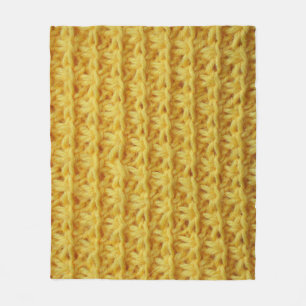 Geel gebreide stof: gestreepte textuur. fleece deken