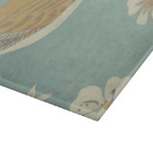 Geel, grijs en beige vogel op een bijkantoor snijplank (Hoek)