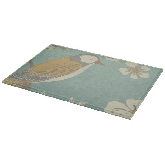 Geel, grijs en beige vogel op een bijkantoor snijplank (Hoek)