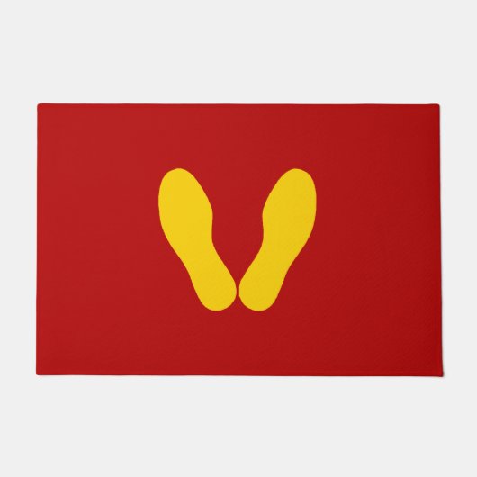 GEEL VOETPRINES OP RODE DEURMAT (Voorkant)