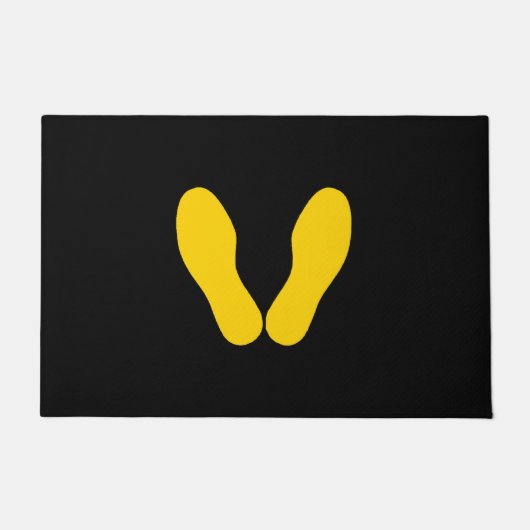 GEEL VOETPRINTS OP ZWART DEURMAT (Voorkant)