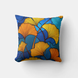 Geglazuurde gele ginkgo bladeren op blauw kussen