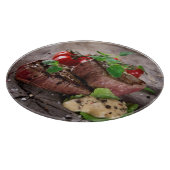 Gegrilde biefsteaks met verse kruiden en tomaten snijplank (Hoek)