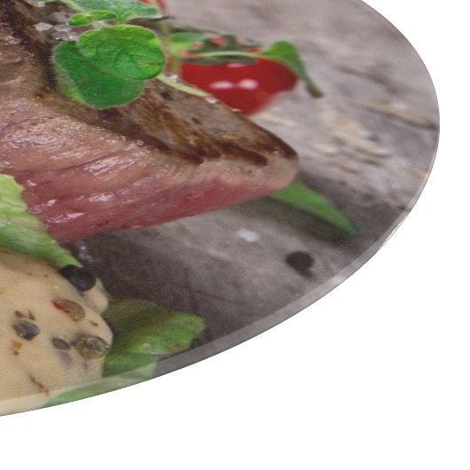 Gegrilde biefsteaks met verse kruiden en tomaten snijplank (Hoek)