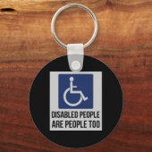Gehandicapten zijn ook mensen voor de gehandicapte sleutelhanger (Achterkant)
