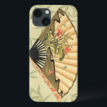 Geisha Fan met bladeren en afdruk van hout iPhone 13 Hoesje<br><div class="desc">Deze prachtige afdruk heeft een geisha-ventilator die opvallend is tegen een achtergrond van drijvende bladeren. De ventilator heeft er ook een mooi en stijlvol bloemontwerp op. Ventilatoren van Aziatische kunst zouden dit aan hun collectie moeten toevoegen!</div>