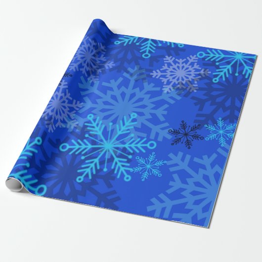Gelaagde sneeuwvlokken op blauw cadeaupapier (Uitgerold)