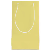 Gele achtergrond van pasteelmaïs, klaar om aan te  klein cadeauzakje (Voorkant)