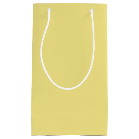 Gele achtergrond van pasteelmaïs, klaar om aan te  klein cadeauzakje (Voorkant)