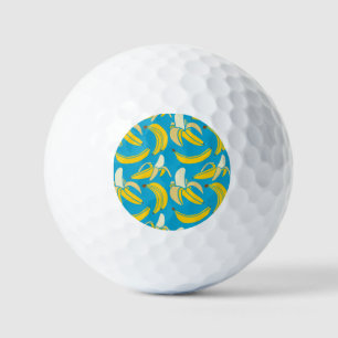 Gele bananen, blauw achtergrondpatroon golfballen